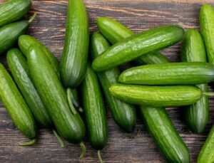 top-view-cucumber-brown-wooden-horizontal